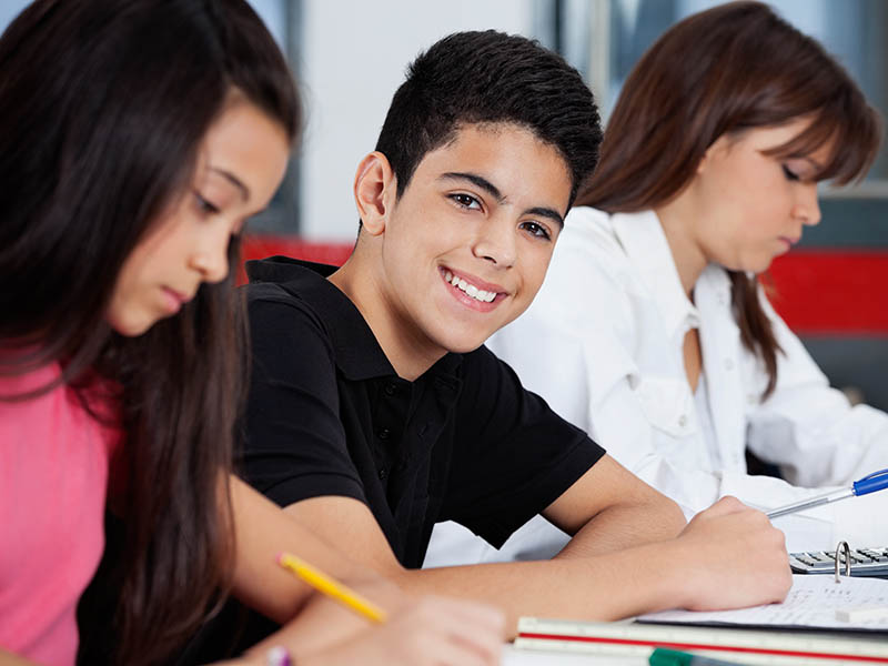 Child with ADHD happy in classroom