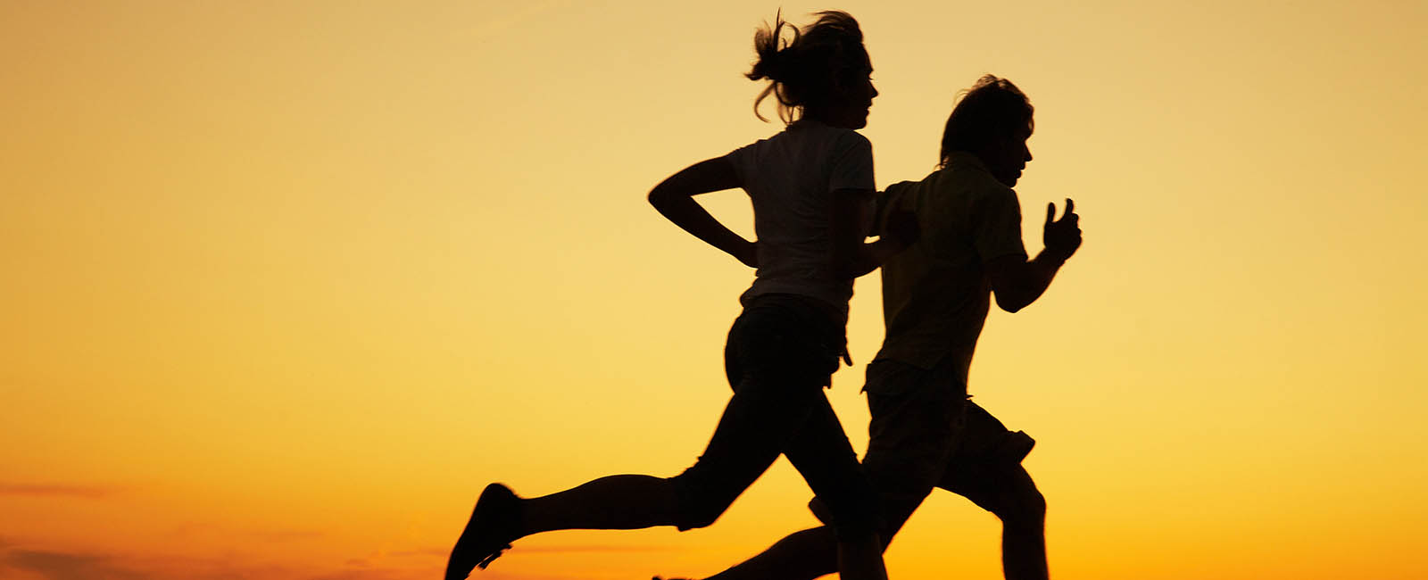 Two runners running early in the morning